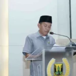 Anggota Komisi I DPRD Kabupaten Sukabumi Muslihin menyampaikan nota pengantar atas Raperda Linmas dalam rapat paripurna, Kamis 2 Maret 2023. | Foto: Dok. DPRD